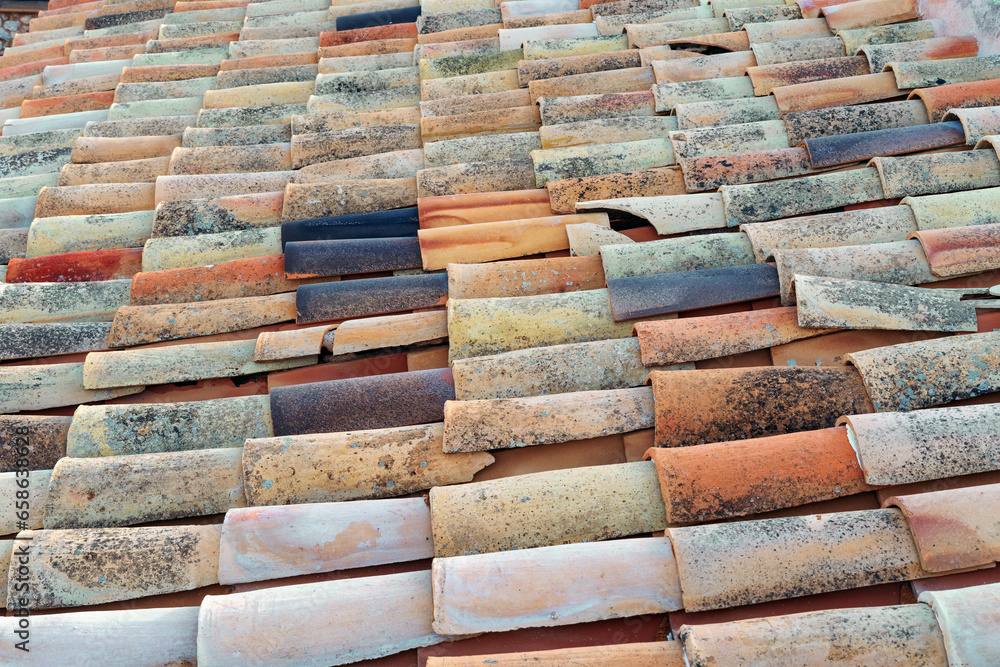 Old multi-colored tiles as a background. Old multi-colored tiles as a background.