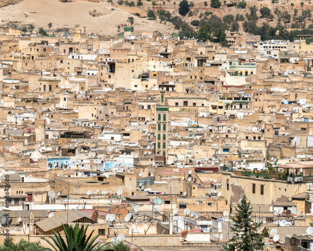 Fes city skyline with green tiled minaret of the Mosque Sidi Ahmed Tijani is a reminder of the city's rich history and heritage, Morocco