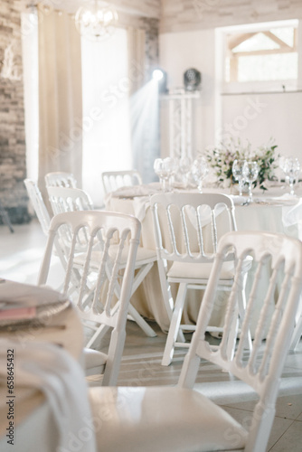 banquet hall in light colors, round tables