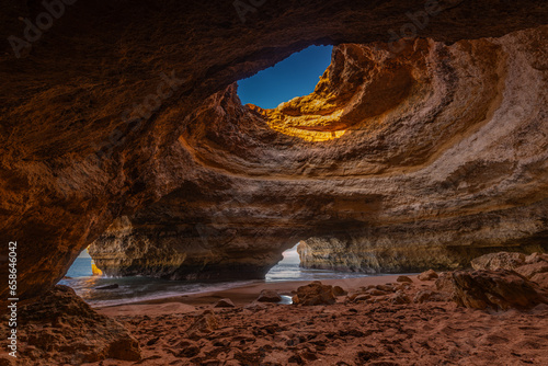 Spectacular sunset view of the Benagil Sea Cave in Algarve, Portugal, Europe