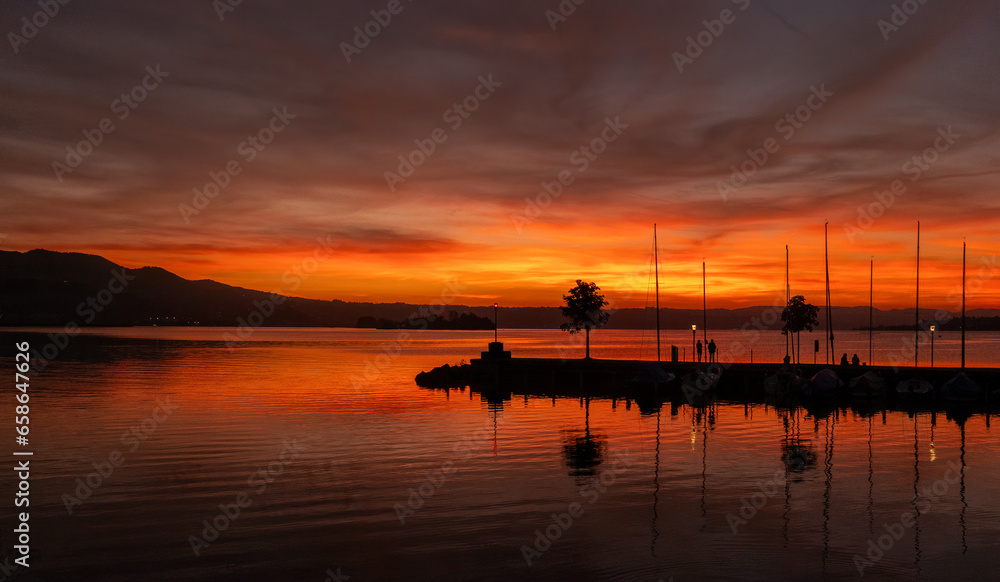 Dramatic sunset on the shiores of the Zurich Lake, Rapperswil, St. Gallen, Switzerland