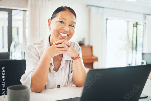 Mature woman, portrait and happy on laptop for home investment, asset management or pension research. Face of Asian person on computer in kitchen for morning email, registration or financial planning