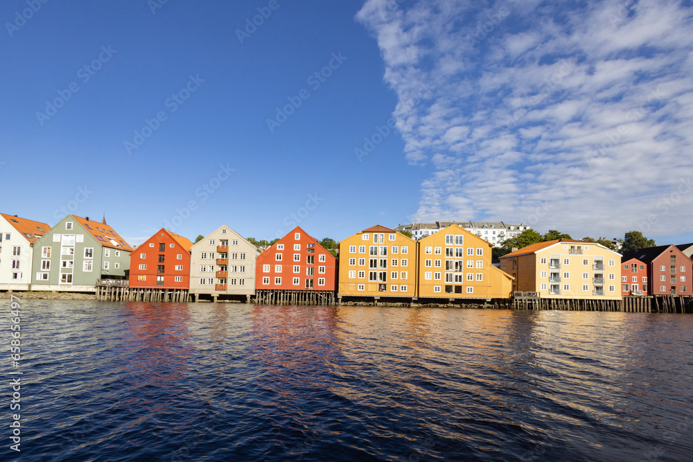 Wandering the banks of the Nidel river in Trondheim city, with old sea houses, Trøndelag, Norway,	