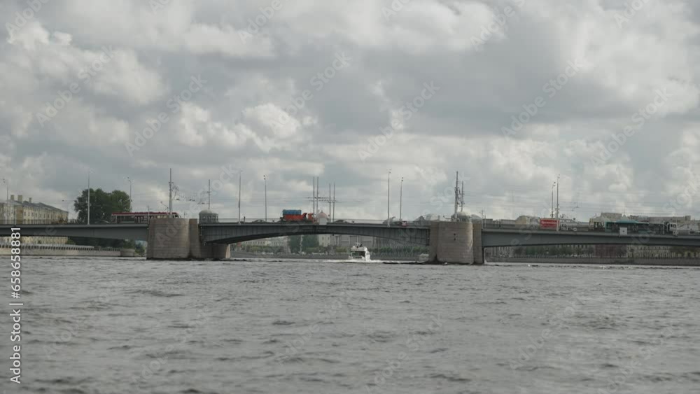 Transport bridge over the Neva River. Sightseeing and infrastructure of St. Petersburg on a river cruise. POV. 4k Transport bridge over the Neva River. Sightseeing and infrastructure of St. Petersburg on a river cruise. POV. 4k