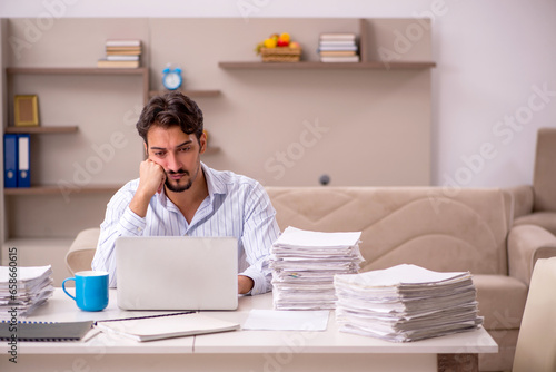 Young businessman employee working from home during pandemic
