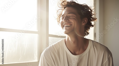 Sunlit Laughter in Cream. Model with sun-kissed skin, laughing heartily against a creamy white backdrop. His posture suggests he just heard a good joke. 