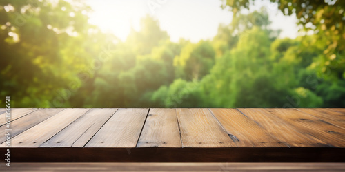 empty wooden table with blurred green garden view on background ,space for product.