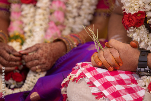 south indian brahmin iter wedding ceremony hands in close up photo