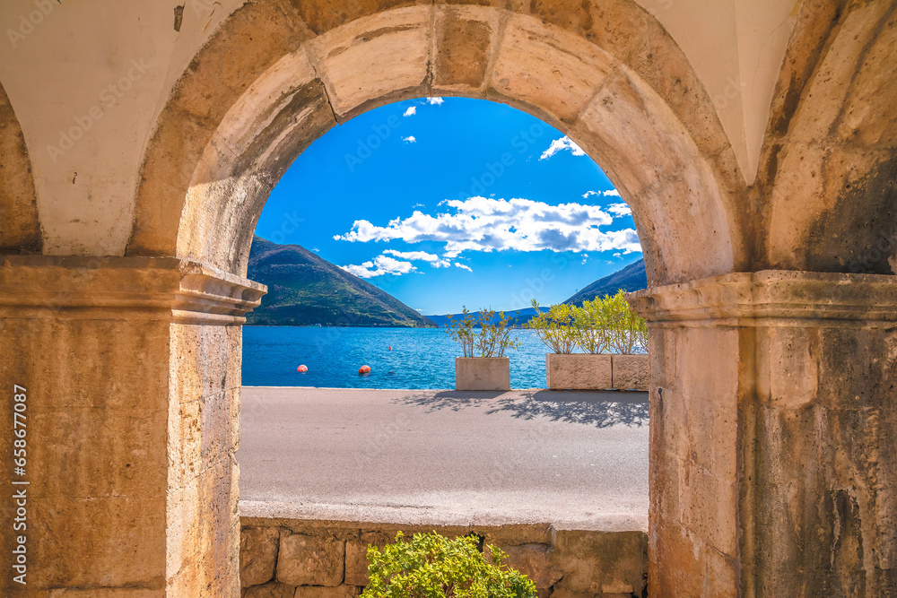 Kotor bay landscape through historic architecture arch
