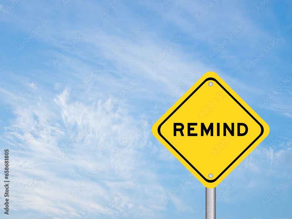 Yellow transportation sign with word remind on blue sky background