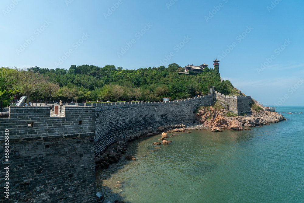 The ancient city walls at sea and the watchtower on the mountain, the Penglai Pavilion in Yantai