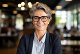 Portrait of smiling middle aged businesswoman