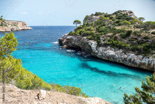 Calo des Moro is where you will think the Caribbean meets the Mediterranean. It is a beautiful virgin beach located between rocks and pine trees that offer a small oasis to rest from the summer heat.