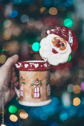 christmas cup in hand of woman