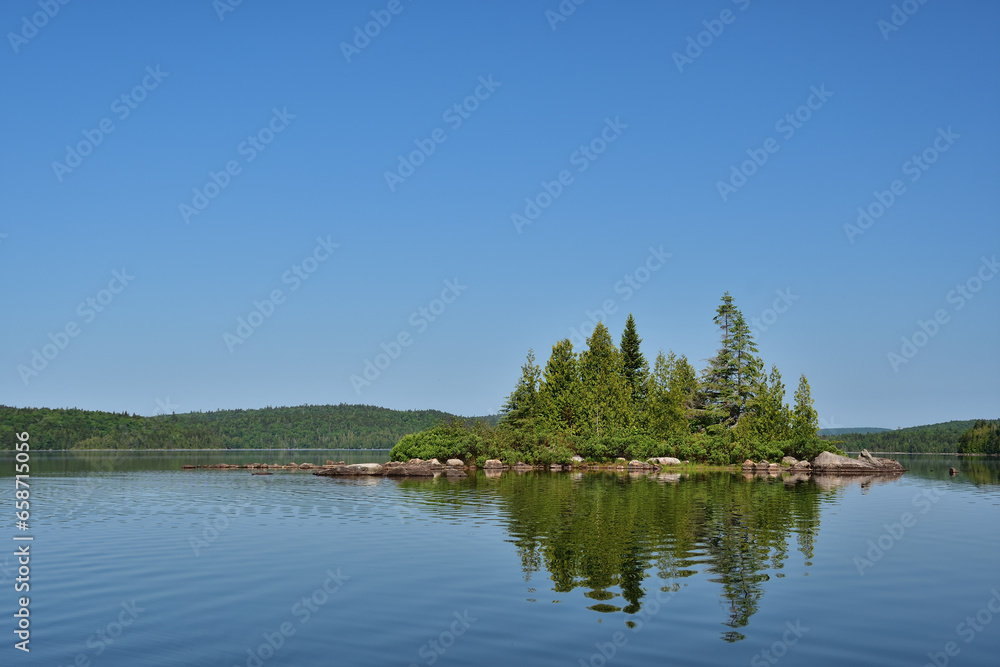 Fototapeta premium La Mauricie National Park Caribou lake. Calm lake with small island