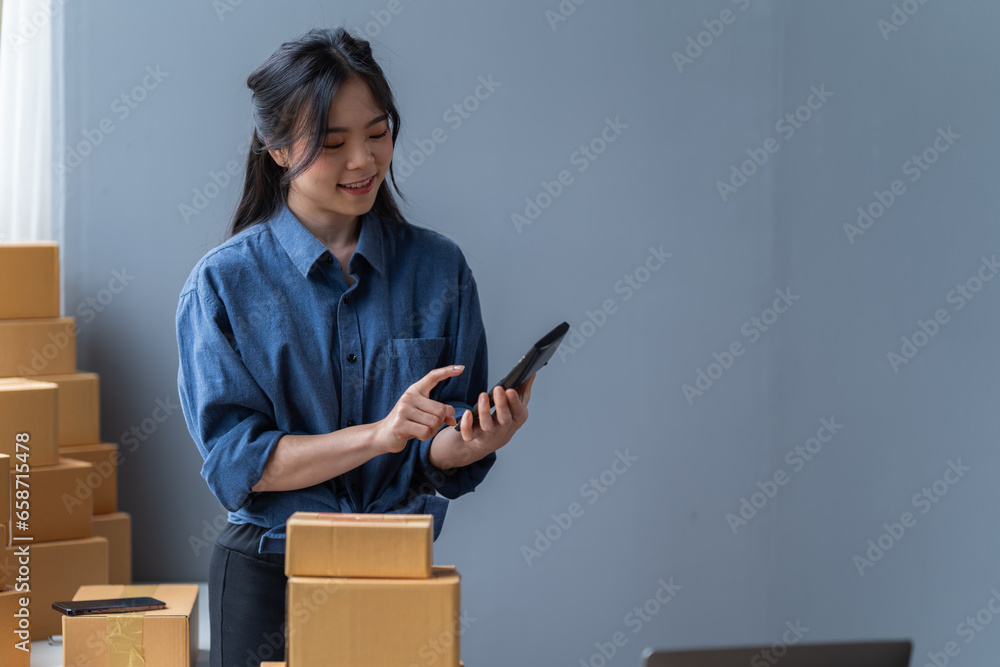 startup girl Small SME business owners work with laptop computers at work. with parcel paper boxes for delivery to customers online selling, Ecommerce, startup girl Small SME business owners work with laptop computers at work. with parcel paper boxes for delivery to customers online selling, Ecommerce,