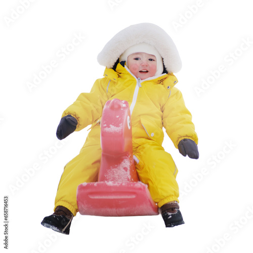 Happy toddler baby boy rides a rocking horse on a winter playground, isolated on white background. A child in a yellow snowsuit in kindergarten. Kid age one year eight months photo