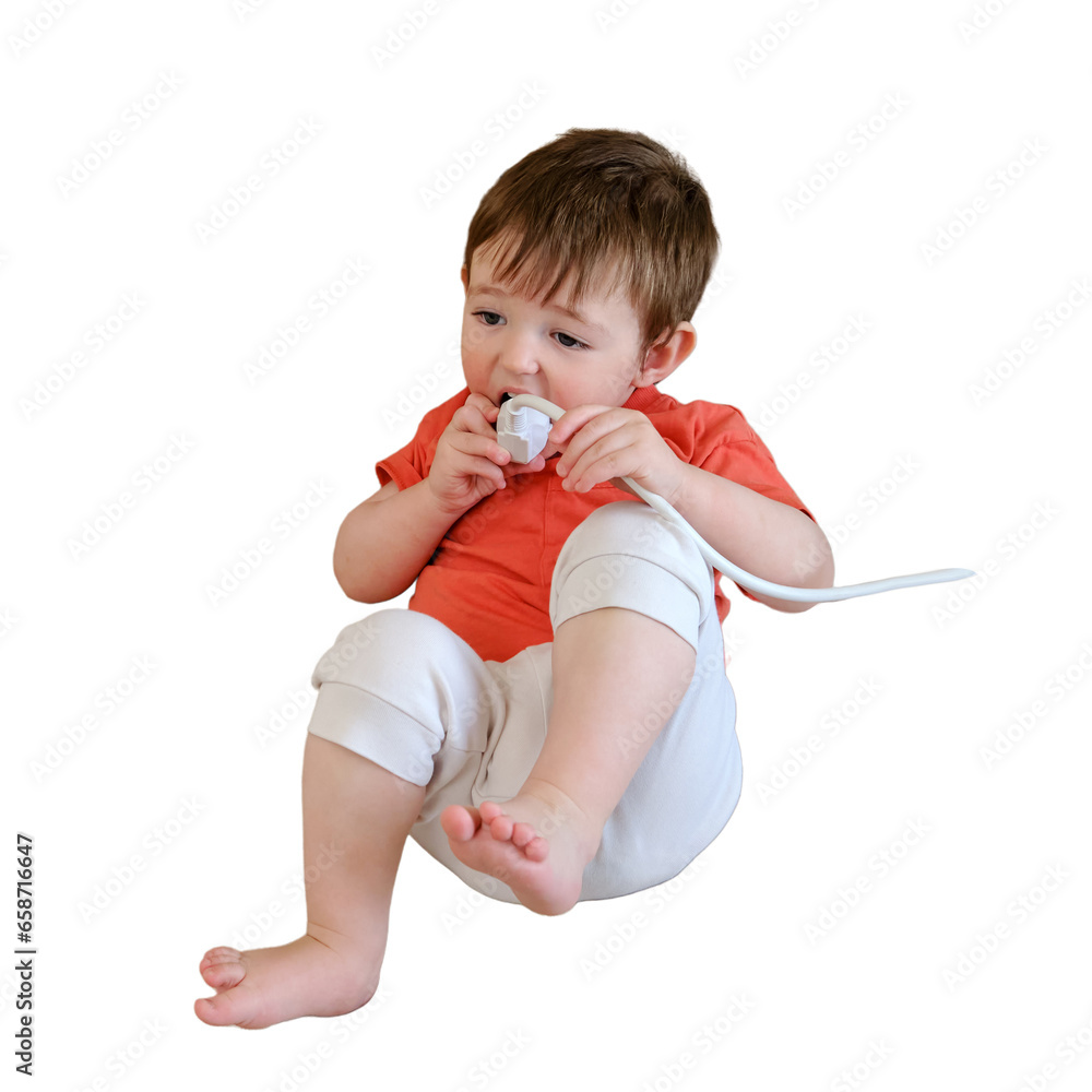 Playing with an electrical cord at home is not a safe activity for the baby and can lead to electric shock or injury, isolated on white background. Kid aged about two years (one year ten months) Playing with an electrical cord at home is not a safe activity for the baby and can lead to electric shock or injury, isolated on white background. Kid aged about two years (one year ten months)