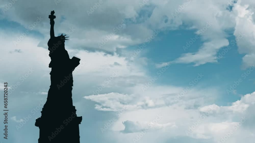 statue of liberty with a blue cloudy sky in a sunny day statue of liberty with a blue cloudy sky in a sunny day
