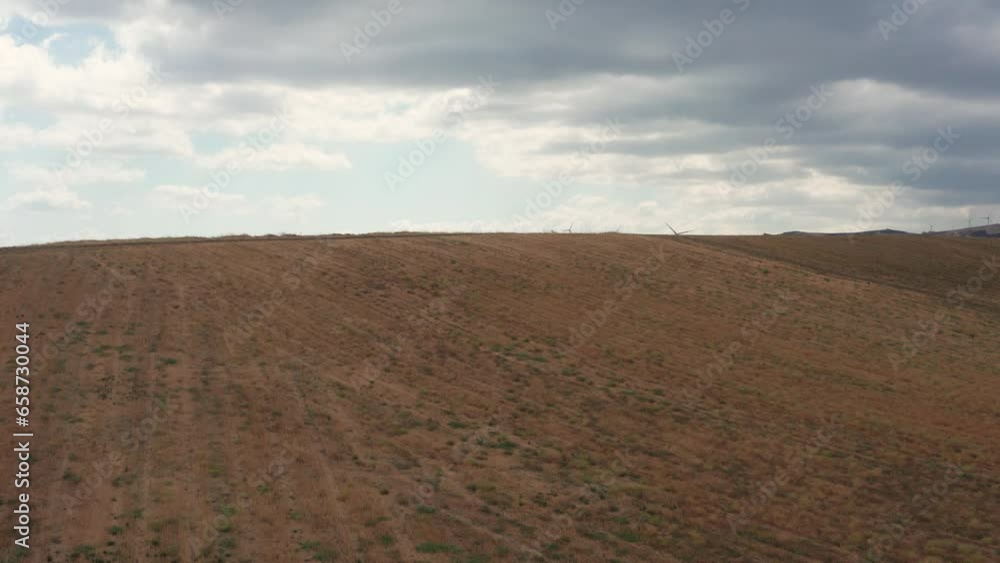 Wind farm on hilly landscape, renewable energy Wind farm on hilly landscape, renewable energy