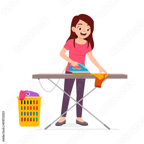 young woman ironing clean clothes and feel happy