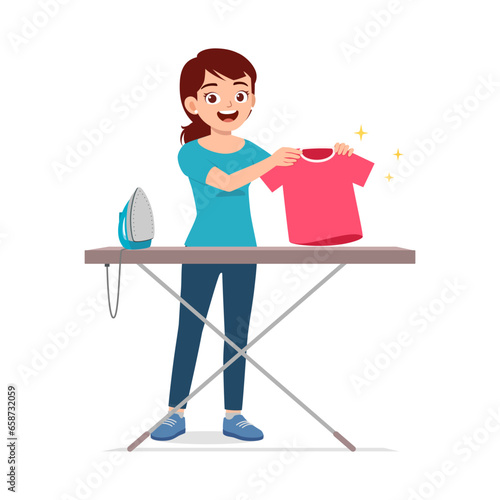 young woman ironing clean clothes and feel happy
