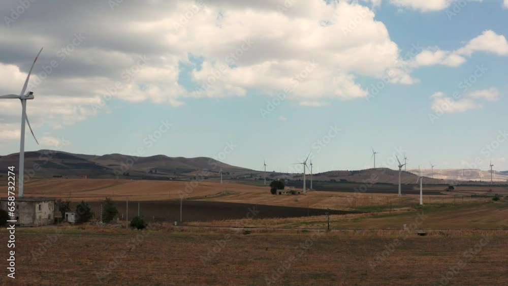 Wind farm on hilly landscape, renewable energy 2 Wind farm on hilly landscape, renewable energy 2