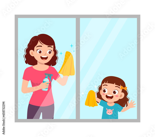 little kid help mother cleaning window
