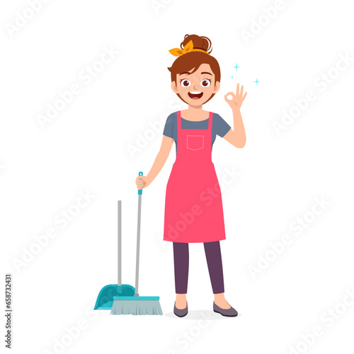 young woman sweep the floor using broom