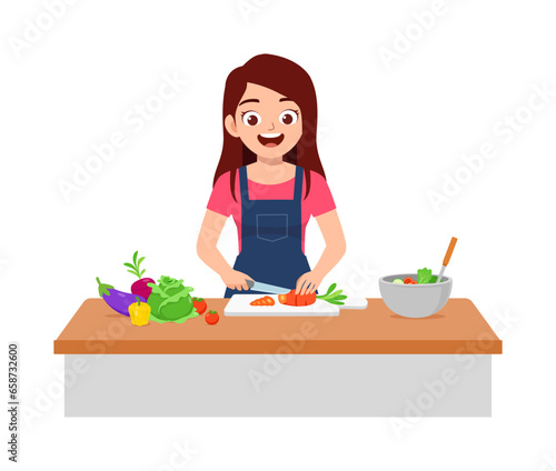 young woman cutting vegetables for cooking salad