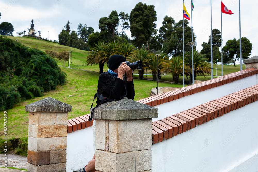 Male tourist taking photos at the famous historic Bridge of Boyaca in Colombia. The Colombian independence Battle of Boyaca took place here on August 7, 1819. Male tourist taking photos at the famous historic Bridge of Boyaca in Colombia. The Colombian independence Battle of Boyaca took place here on August 7, 1819.