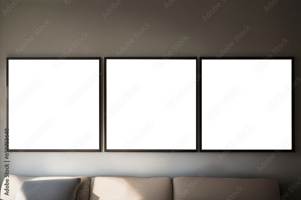 3 square frames on grey wall in room interior