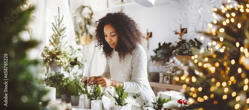 Photo African American woman florist creating Christmas decor in flower shop