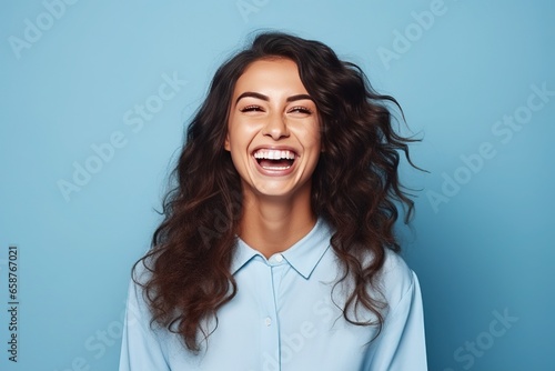 Happy young woman curly hair. smiling and laughing, she is happy in isolated studio with bright solid background light. Generated by AI.