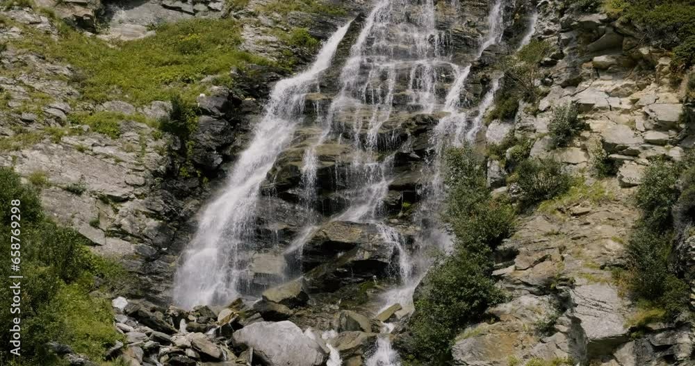 Rocky mountain waterfall in summer - Italian Alps Rocky mountain waterfall in summer - Italian Alps