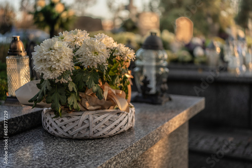 Flowers placed on graves at a cemetery, Poland, November 1 — All Saints' Day (also known as All Souls' Day / Day of the Dead)
