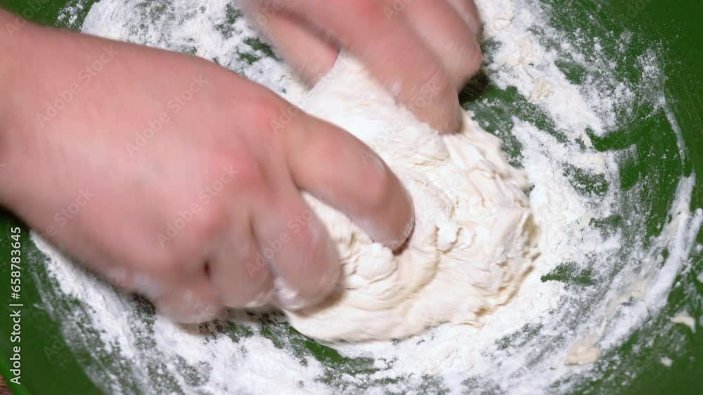 Baker kneading dough in flour on table. Baker kneading dough in flour on table.