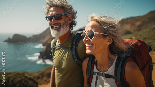 portrait of Senior couple admiring the scenic Pacific coast while hiking, filled with wonder at the beauty of nature during their active retirement © Guillaume