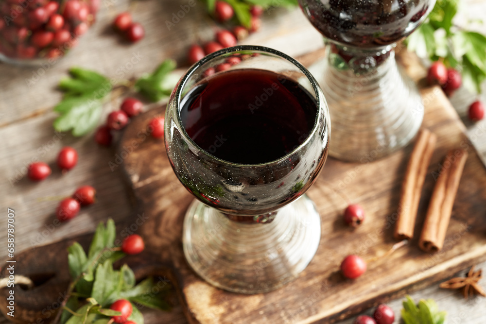 Medicinal wine made of fresh hawthorn berries in vintage glass