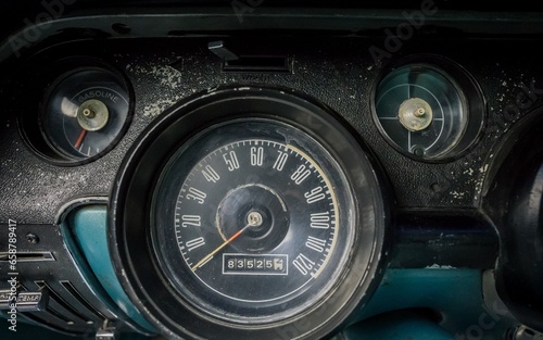 Speedometer inside of a old car photo