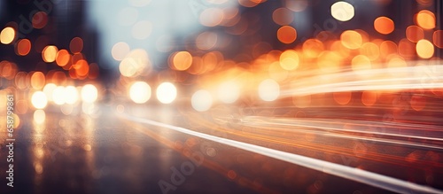 City traffic road illuminated by car lights creates bokeh With copyspace for text