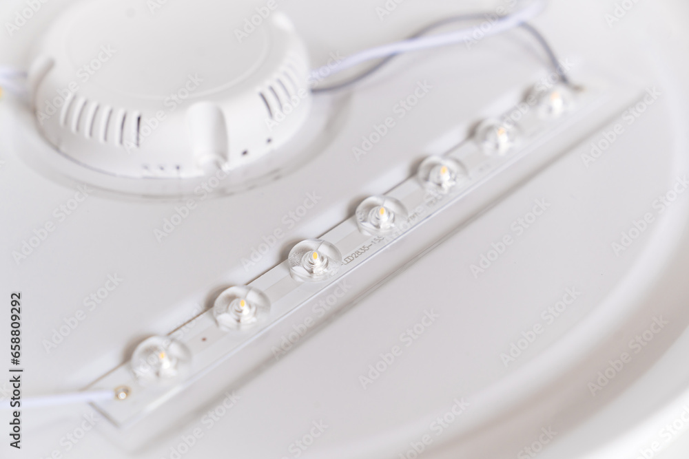 close-up. part of the lamp with LED bulbs on a white surface. close-up. part of the lamp with LED bulbs on a white surface.