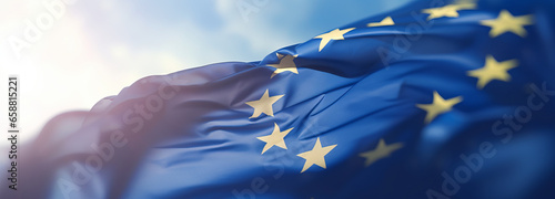 Obraz na plátně Flag of European Union waving in the breeze against a sunset sky