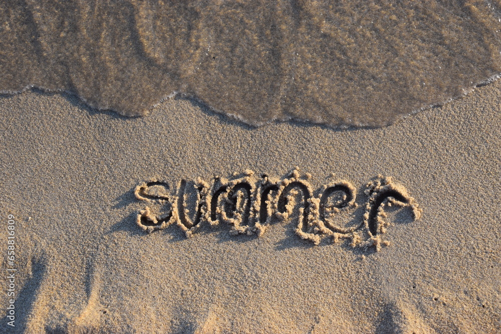 Fototapeta premium Inscription summer on wet sand. Holiday, rest and enjoyment