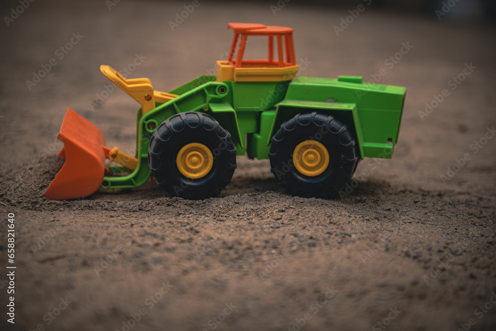 Fototapeta premium Construction equipment grader and excavator. Toy excavator. Construction