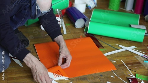 Vinyl Film. Large Sticker. Separating film from paper. Creating a Sticker.