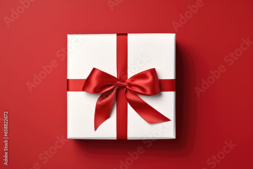 White gift box with red ribbon. © Maria