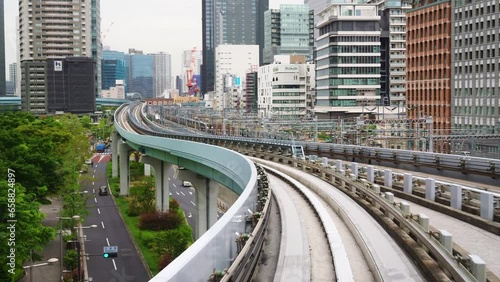 Tokyo train line, automated transit between Shimbashi to Toyosu, via Odaiba across the Rainbow Bridge. monorail train in modern urban center. photo