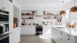 Halloween concept. White modern kitchen decorated for fall with orange pumpkins and leaves