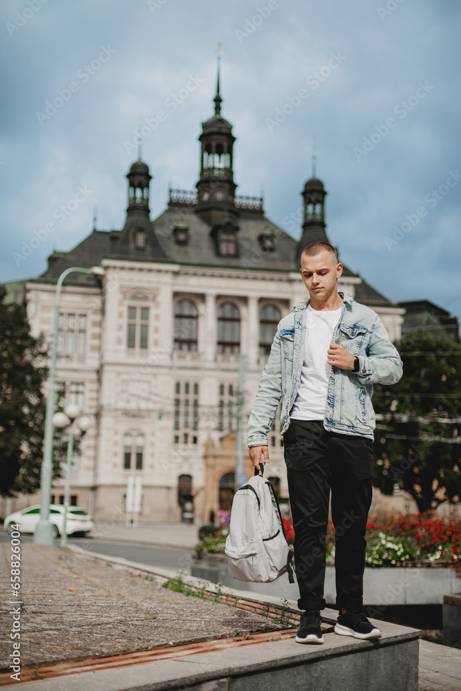 Teenage Adventurer. Young Boy Strolling Through European City with Backpack. City Adventure. Young Boy Tourist with Backpack in European Locale.